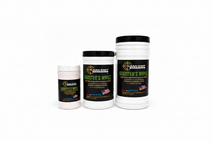 Three white plastic jars of Clean Shot Hand & Surface Wipes with black lids, arranged by size against a white background. The labels are black with green and yellow text and feature the Clean Shot brand logo.