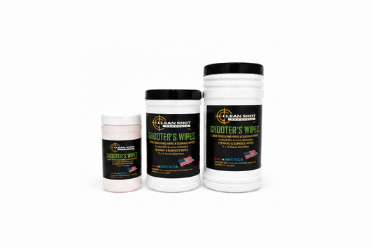 Three white plastic jars of Clean Shot Hand & Surface Wipes with black lids, arranged by size against a white background. The labels are black with green and yellow text and feature the Clean Shot brand logo.